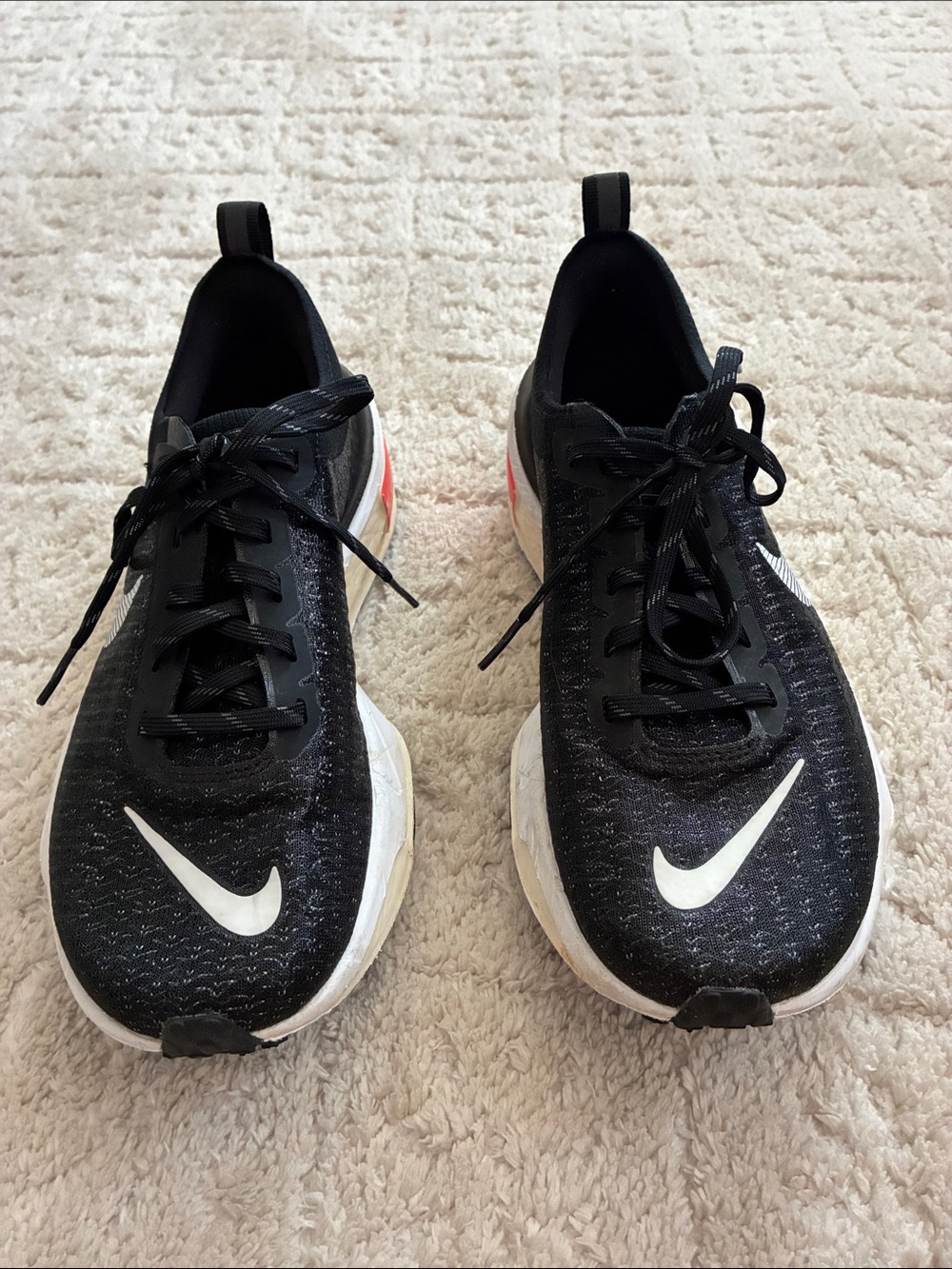 Nike Zoom Black Running Shoes with White Swoosh and Red Heel Accent